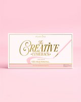Recto d'une palette de fards à paupières arc-en-ciel P.Louise Creative COmeback XXXL fermée avec typographie dorée sur un boîtier rose sur fond rose