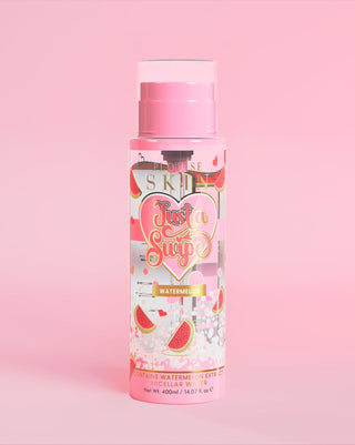 A bottle of P. Louise Just A Swipe watermelon scented micellar water with watermelon design on the bottle against a pink background