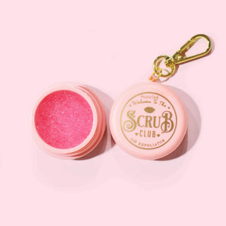 Pink P.Louise keychain lip scrub with open lid on a pink background, featuring 'Scrub Club' branding.