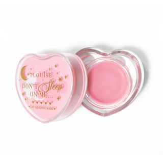 Pink heart-shaped lip sleeping mask with the lid off on a white background