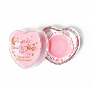 Pink heart-shaped lip sleeping mask with the lid off on a white background