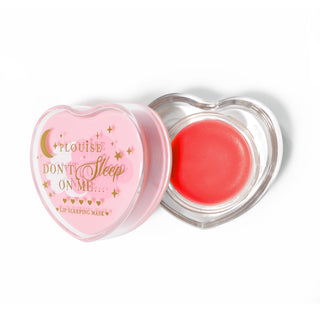 Pink heart-shaped lip sleeping mask with the lid off on a white background