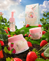 P.Louise Strawberry Obsessed For Less Double Cleanse & Moisturise Skincare Set on a grassy hill surrounded by strawberries