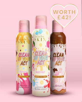 Three bottles of P.Louise whipped body foam body wash with colourful packaging on a pink background.