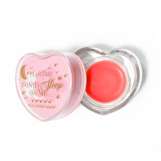 Pink heart-shaped lip sleeping mask with the lid off on a white background