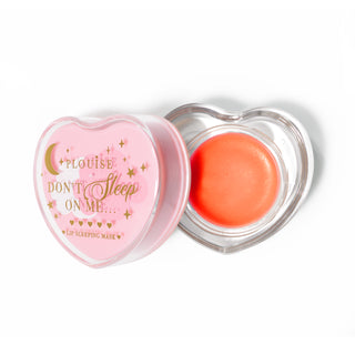 Pink heart-shaped lip sleeping mask with the lid off on a white background