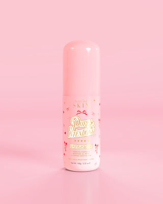 Pink bottle of P.Louise Pure Intentions Purify & Brightening Lotion with red bow designs against a pink background